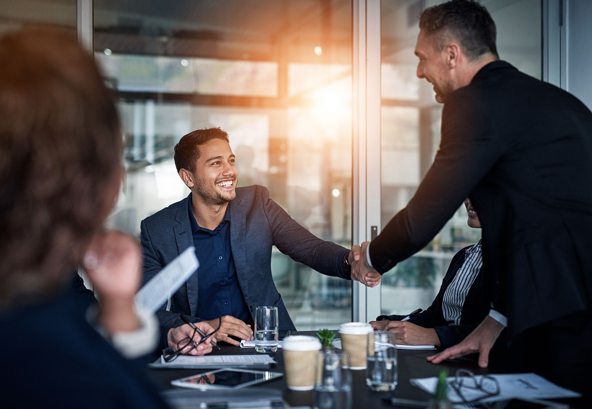 Business, people and handshake in meeting office for b2b partnership, recruitment and agreement of onboarding. Smile, men and collaboration for welcome, promotion and opportunity of negotiation deal