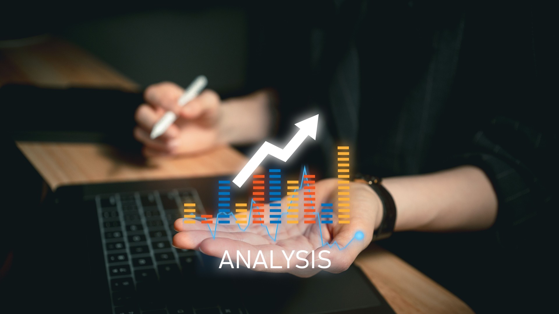 Businessperson holding glowing financial chart with analysis text and upward trend over laptop showcasing data evaluation and growth insight